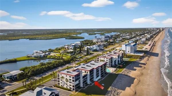 an aerial view of a city with lawn chairs