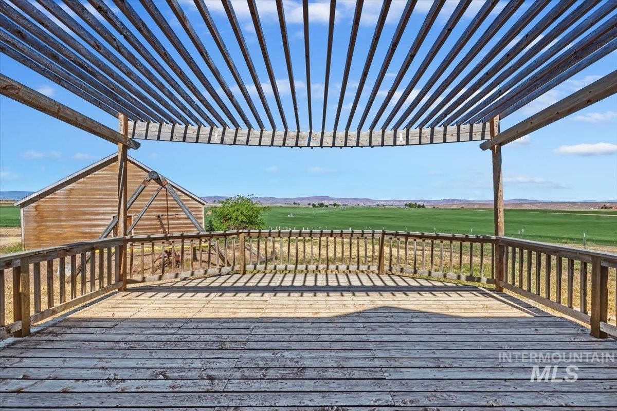 2331 Gulley Road Homedale, ID 83628 - Photo 31 of 46 Expansive outdoor deck featuring wood plank flooring and a slatted pergola overhead