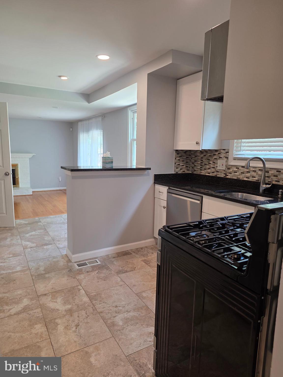 3002 Ivy Bridge Road Fort Washington, MD 20744 - Photo 13 of 65 a kitchen with granite countertop a stove and a sink