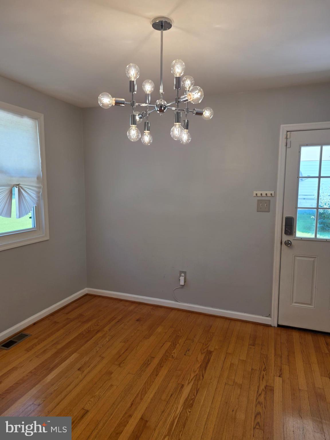 3002 Ivy Bridge Road Fort Washington, MD 20744 - Photo 15 of 65 a view of a room with wooden floor and chandelier fan