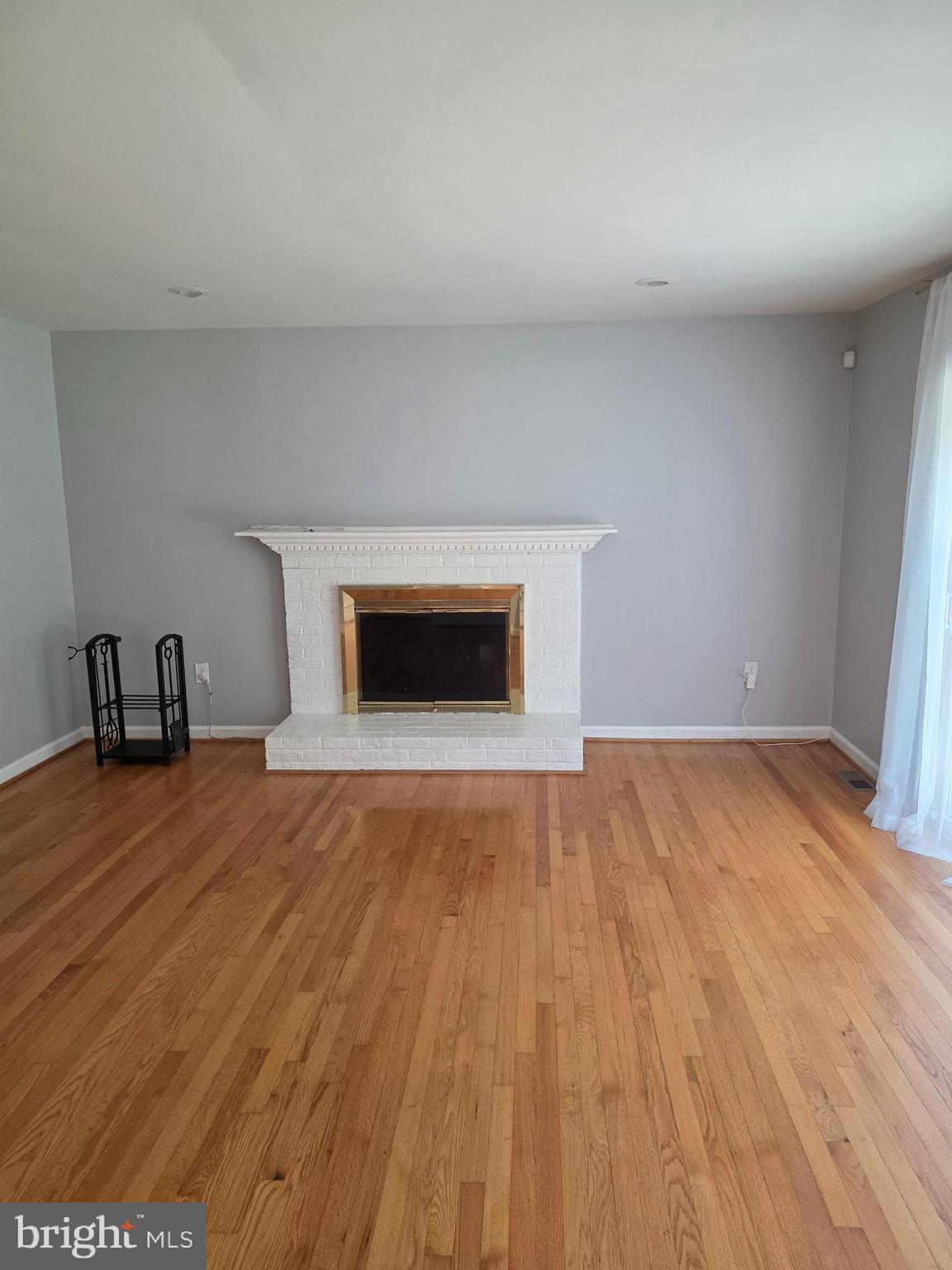 3002 Ivy Bridge Road Fort Washington, MD 20744 - Photo 19 of 65 a view of empty room with wooden floor and fireplace