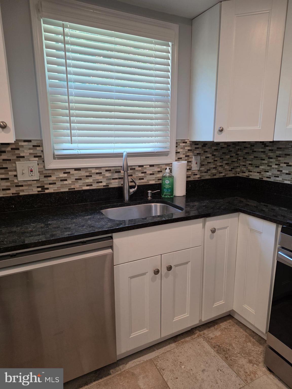 3002 Ivy Bridge Road Fort Washington, MD 20744 - Photo 20 of 71 a kitchen with granite countertop white cabinets and a sink