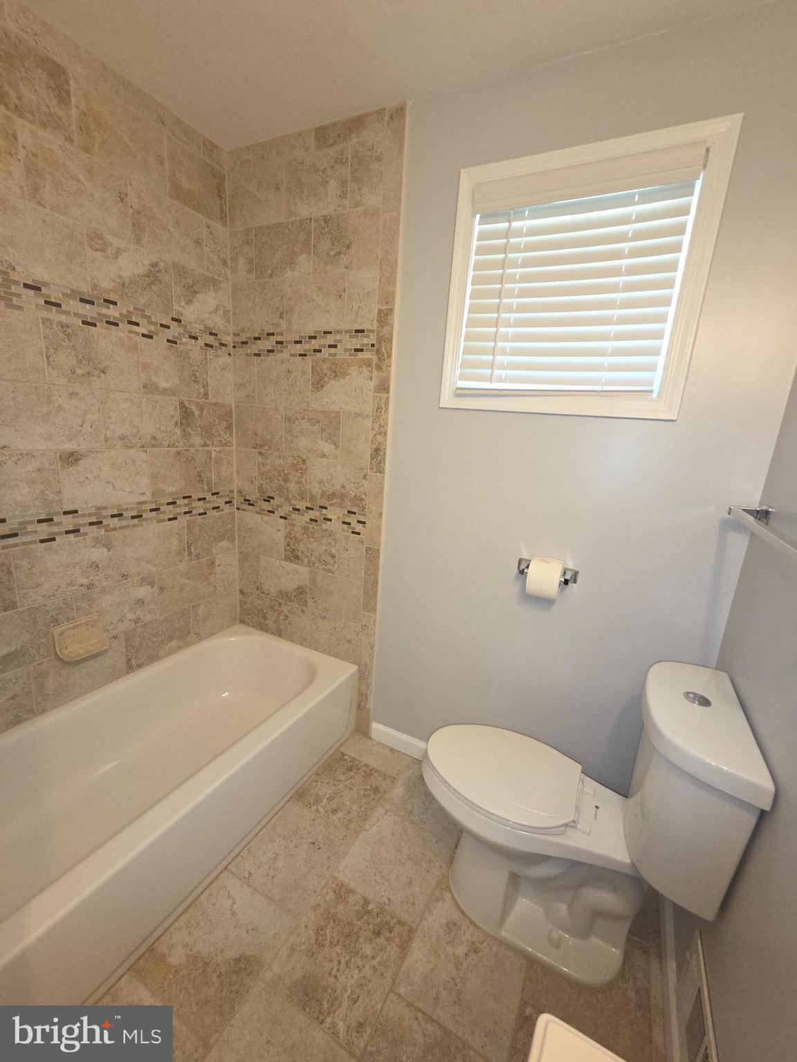 3002 Ivy Bridge Road Fort Washington, MD 20744 - Photo 23 of 65 a bath room with a toilet and a bath tub