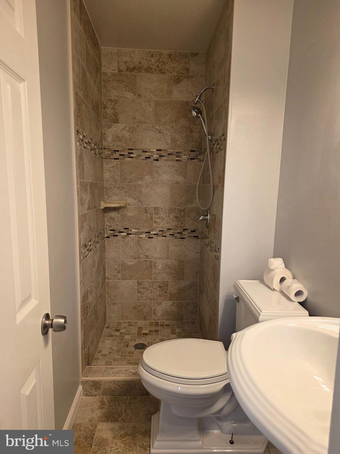 3002 Ivy Bridge Road Fort Washington, MD 20744 - Photo 24 of 71 a white toilet sitting next to a bathroom sink and a shower