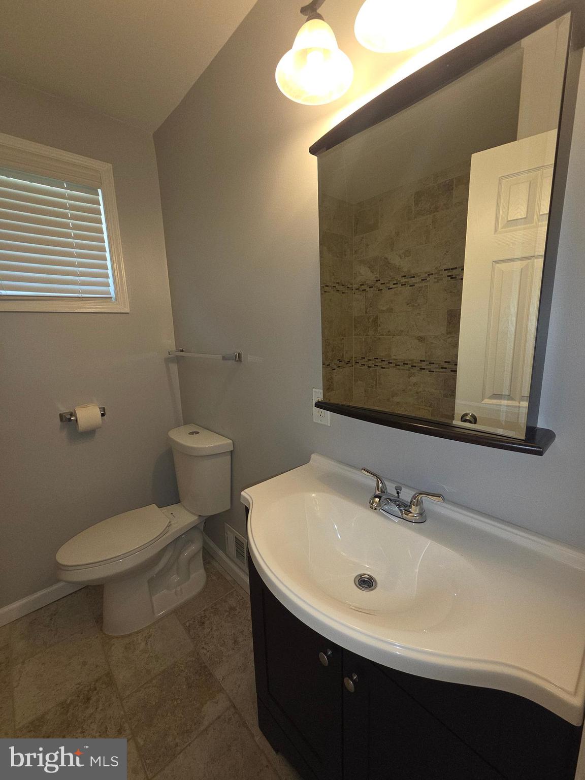 3002 Ivy Bridge Road Fort Washington, MD 20744 - Photo 40 of 65 a bathroom with a sink a toilet and mirror