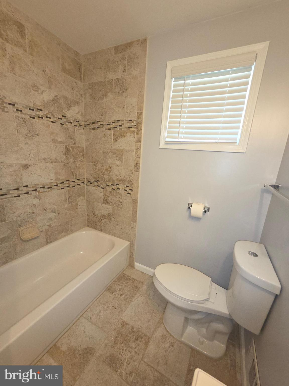 3002 Ivy Bridge Road Fort Washington, MD 20744 - Photo 41 of 65 a bath room with a toilet and a bath tub