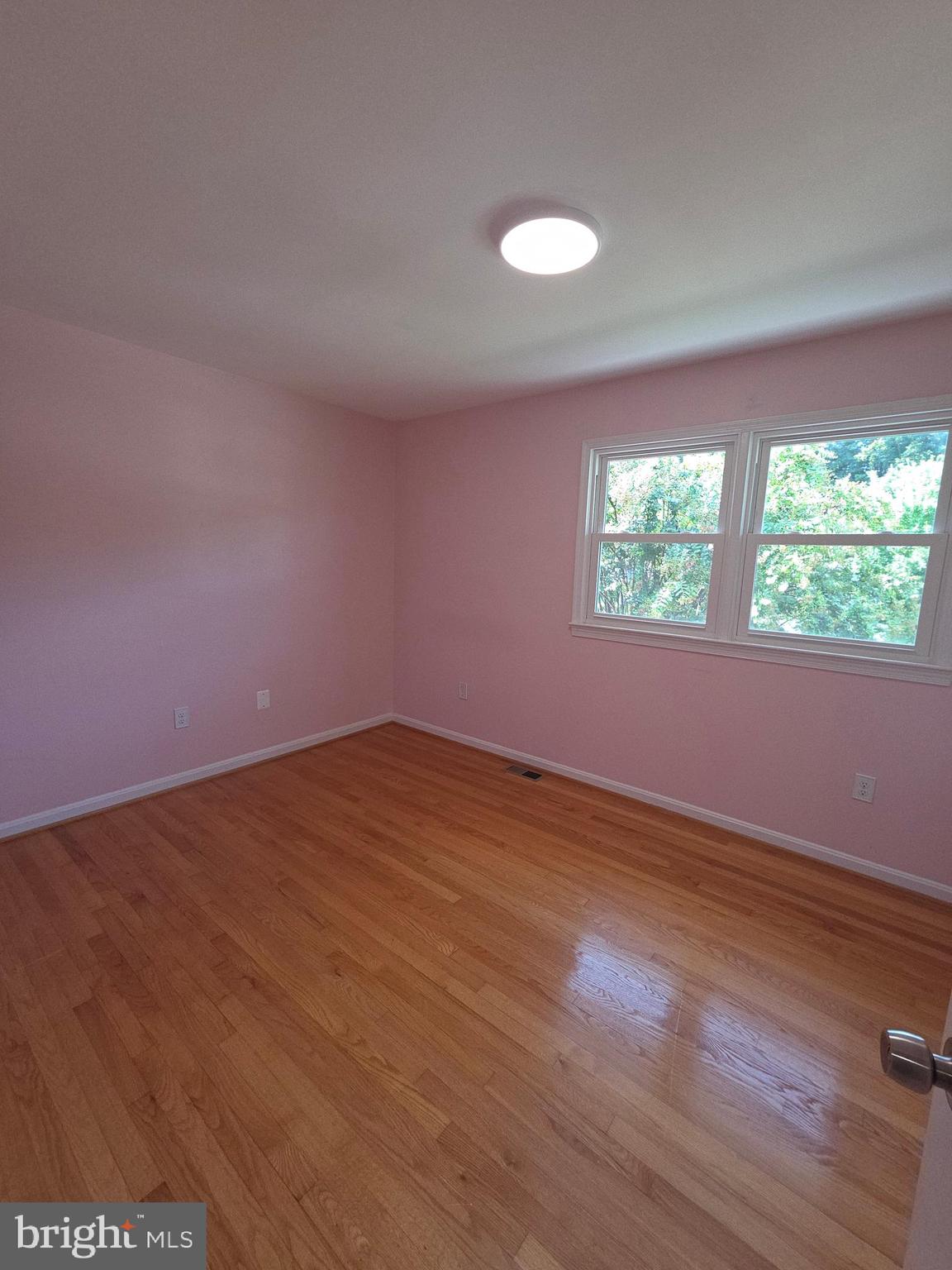 3002 Ivy Bridge Road Fort Washington, MD 20744 - Photo 44 of 65 an empty room with wooden floor and windows
