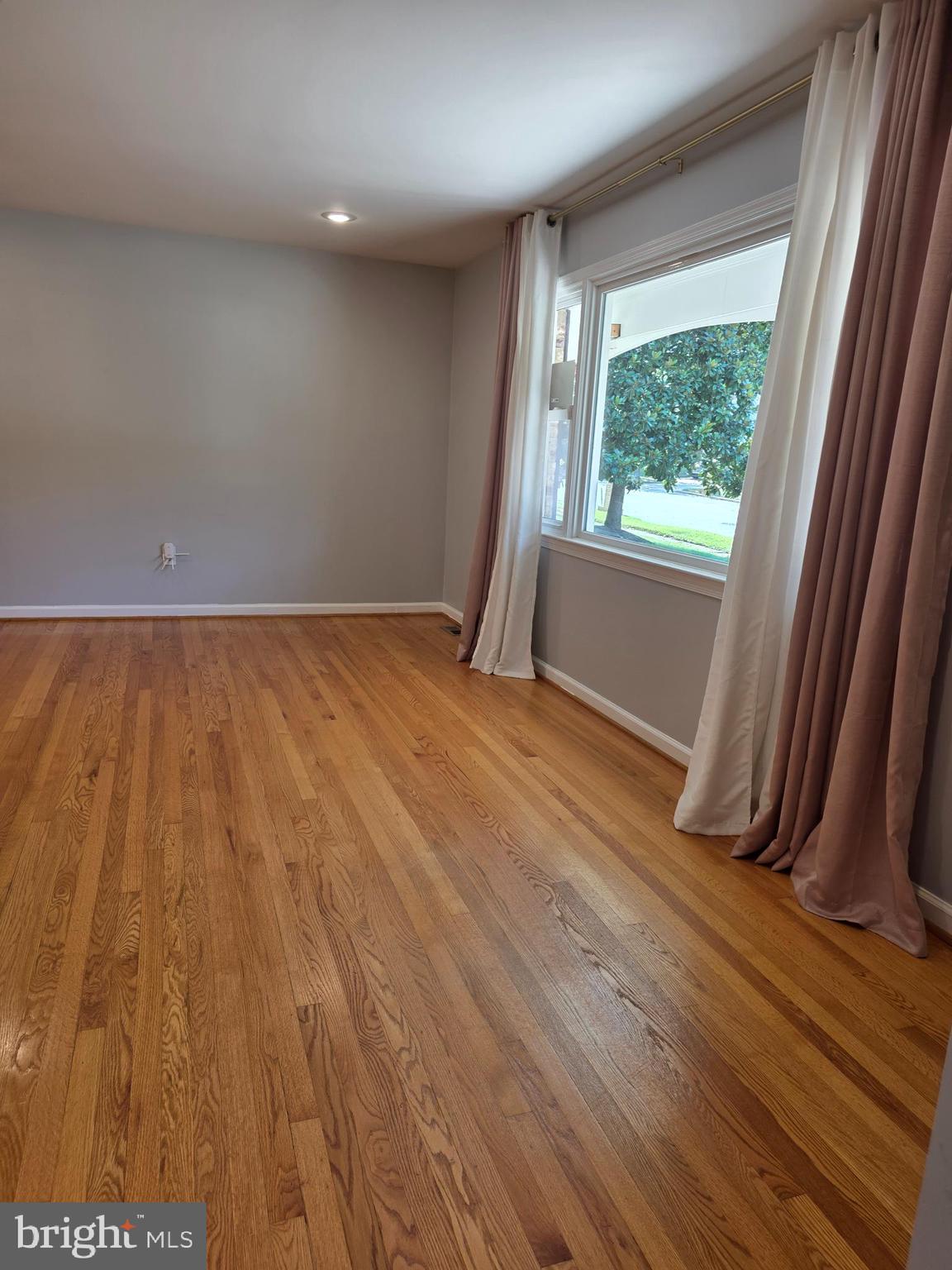 3002 Ivy Bridge Road Fort Washington, MD 20744 - Photo 9 of 65 an empty room with wooden floor and windows