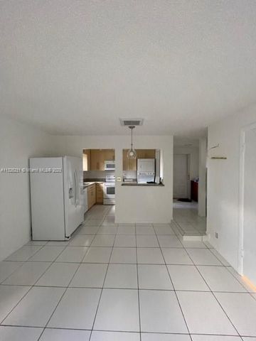 a view of a kitchen with furniture and cabinets