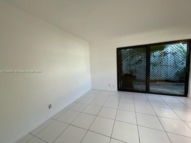 a view of a room with a large sliding door