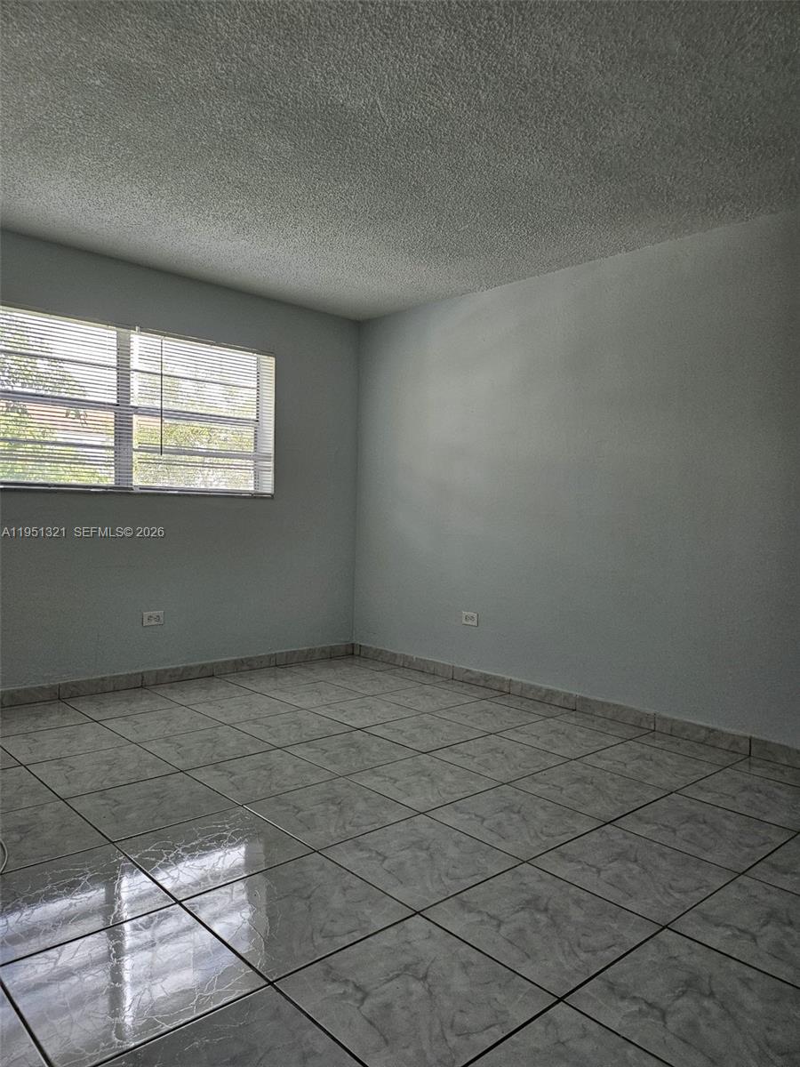 8101 Southwest 73rd Avenue, Unit 6 Miami, FL 33143 - Photo 3 of 18 an empty room with windows