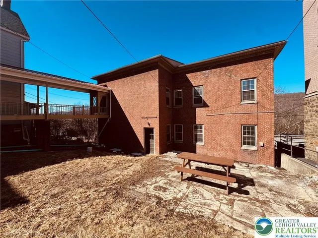 a view of a backyard of a house