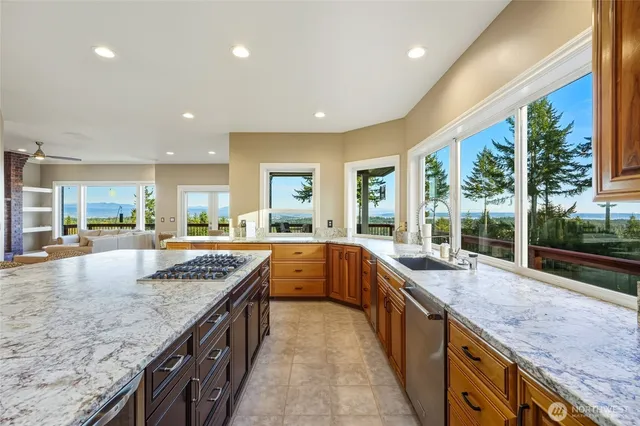 a large kitchen with stainless steel appliances granite countertop plenty of counter space