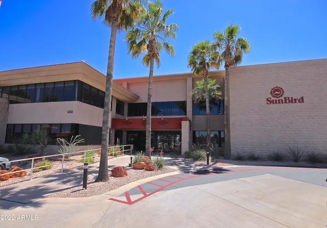 a living room with furniture fireplace and flat screen tv
