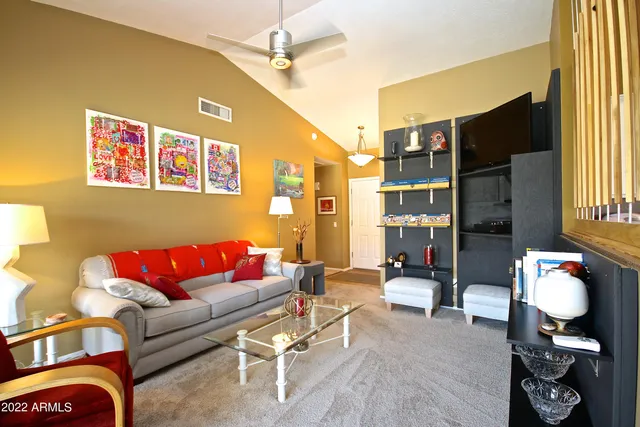 a living room with furniture workspace and a window