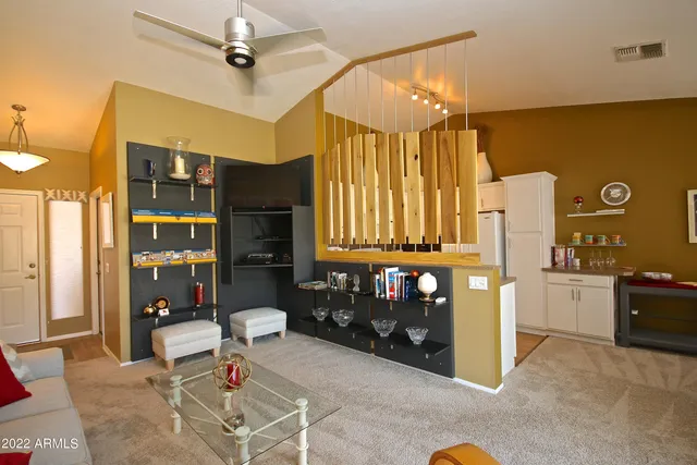 a kitchen with a refrigerator and a stove