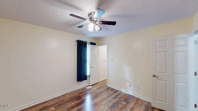 a kitchen with stainless steel appliances granite countertop a refrigerator a stove and a sink with cabinets