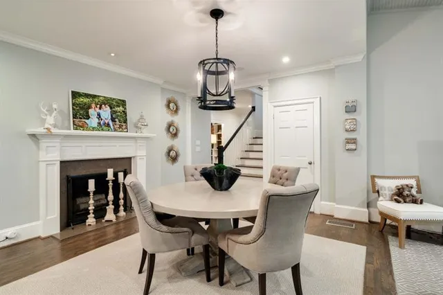 a bed room with a bed and painting on the wall