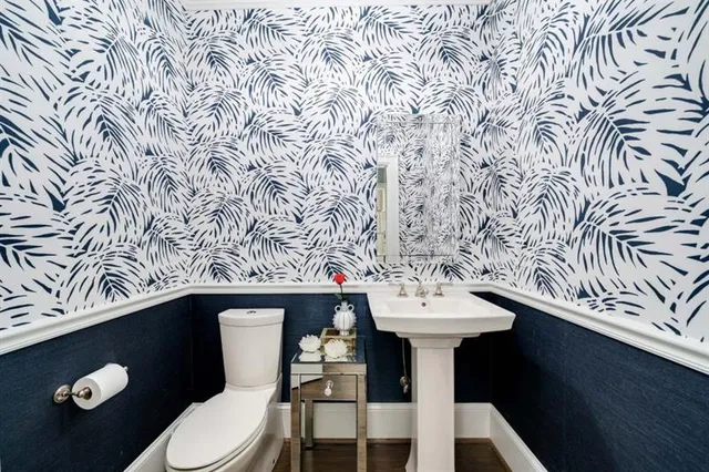 a spacious bedroom with a bed and a large window