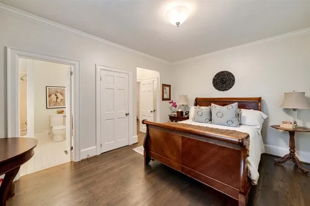 a spacious bathroom with a tub sink shower and mirror