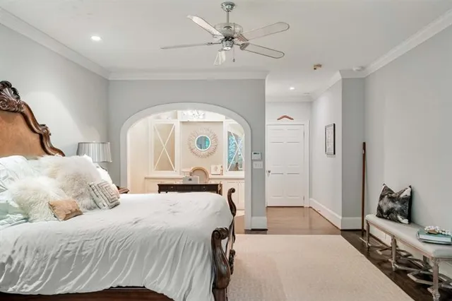 a view of room with wooden floor and fan