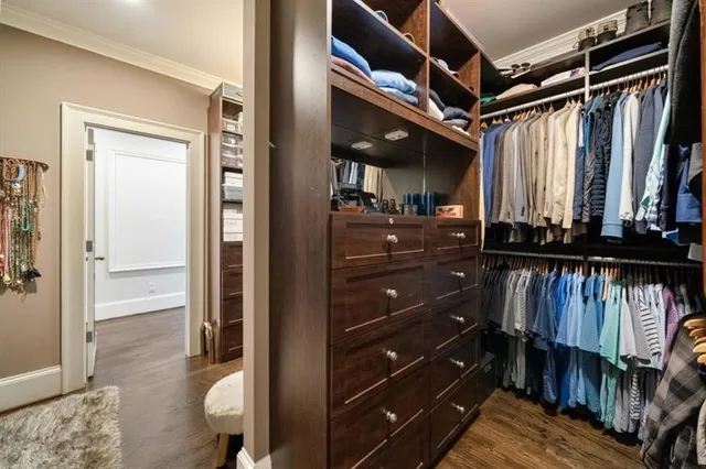 a bathroom with a granite countertop toilet sink and mirror