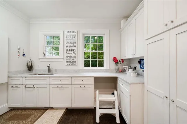 a spacious bathroom with a double vanity sink and a mirror