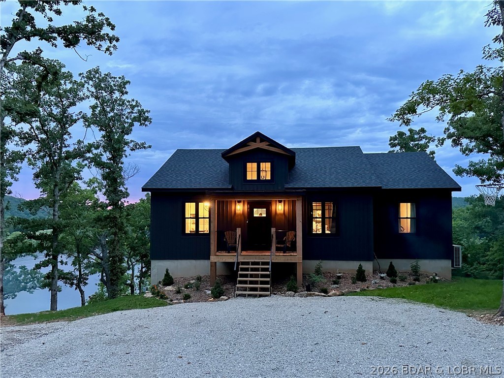 139 Jumping Bass Cove Road Roach, MO 65787 - Photo 1 of 57 street side elevation