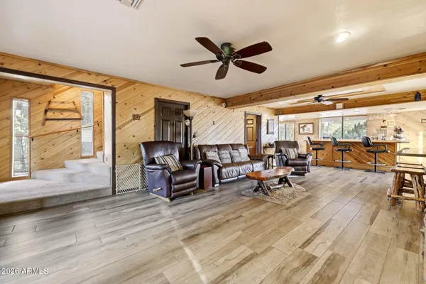 a front view of a house with outdoor seating