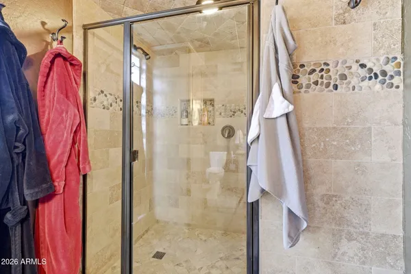 a living room with furniture a wooden floor and next to a window
