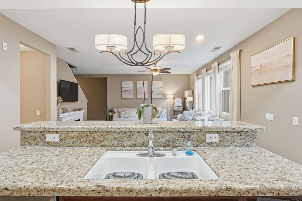 60 Via Sovana Santee, CA 92071 - Photo 17 of 26 a bathroom with a granite countertop sink and a mirror