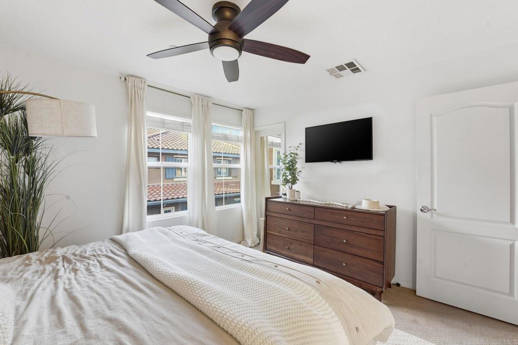 60 Via Sovana Santee, CA 92071 - Photo 3 of 26 a bedroom with a bed and a flat screen tv