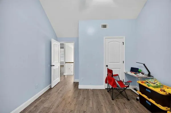 a room with furniture and air hockey table