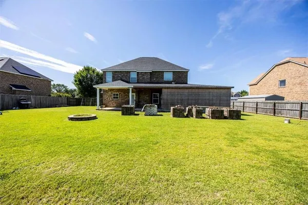 a view of a swimming pool with an outdoor space and seating area