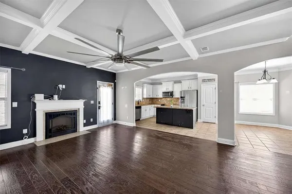 a view of a kitchen with a sink and a fireplace