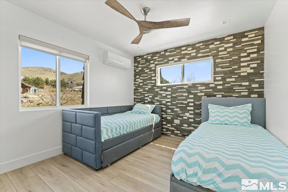 2665 Westview Boulevard Sparks, NV 89434 - Photo 17 of 33 a bedroom with a bed and a night stand