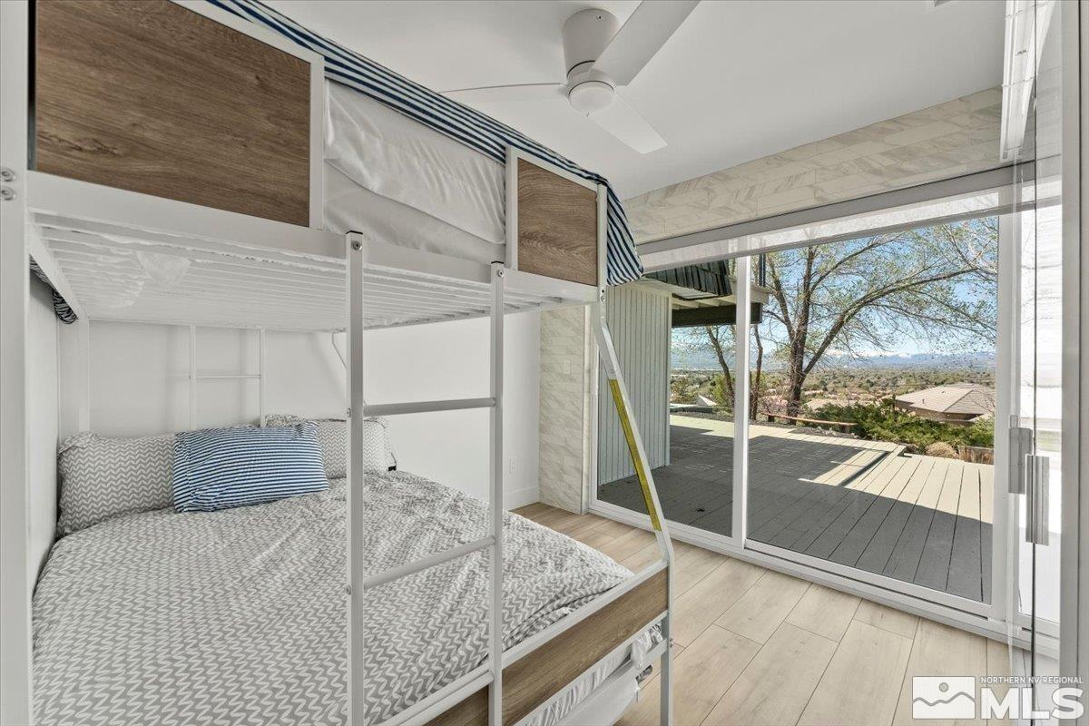 2665 Westview Boulevard Sparks, NV 89434 - Photo 21 of 33 a bedroom with a bed and glass door