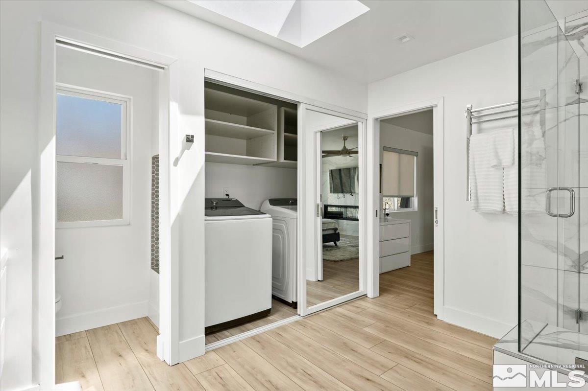 2665 Westview Boulevard Sparks, NV 89434 - Photo 23 of 33 a view of a walk in closet and bedroom with wooden floor