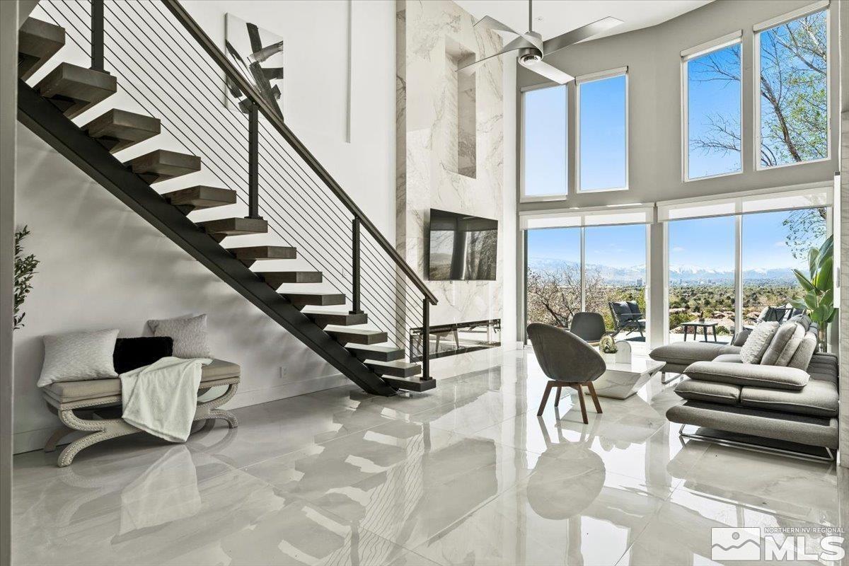 2665 Westview Boulevard Sparks, NV 89434 - Photo 4 of 33 a living room with furniture or stairs and a rug