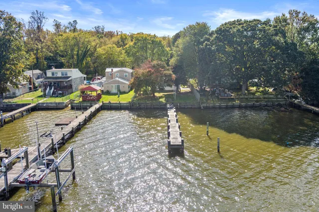 a view of a lake with a car park in front of it
