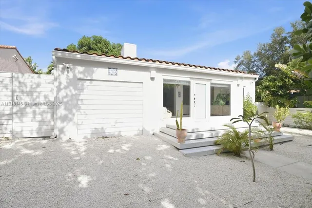 a view of a chair and table in the patio
