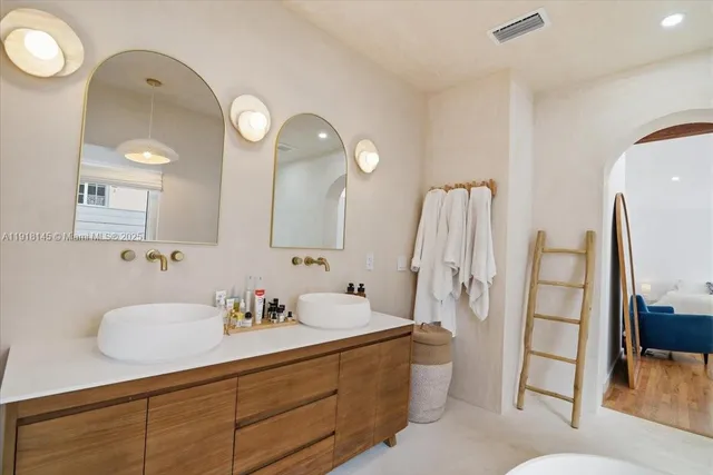 a bathroom with a toilet sink and shower