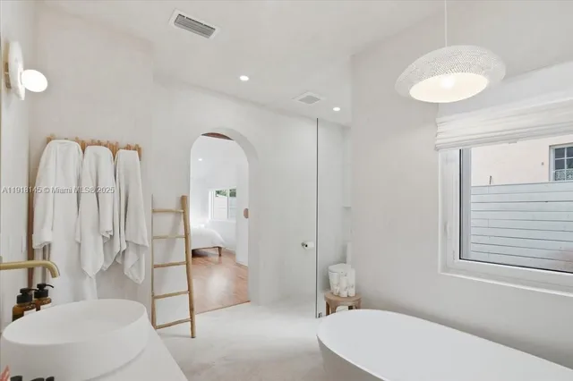 a bedroom with a bed and a table in it