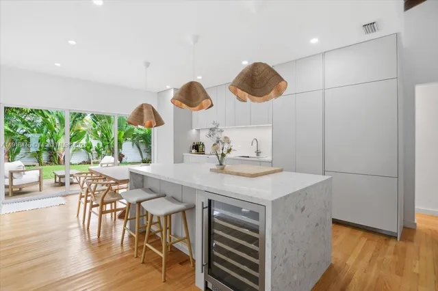 a kitchen with a table and chairs in it