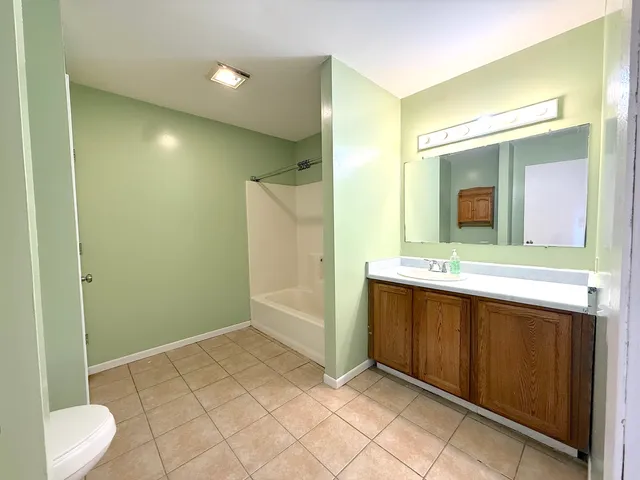 a bathroom with a sink and mirror
