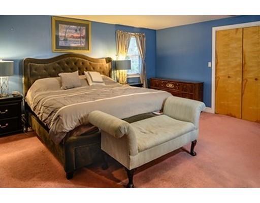 250 Edgewater Drive Needham, MA 02492 - Photo 11 of 27 a bedroom with a bed and wooden floor