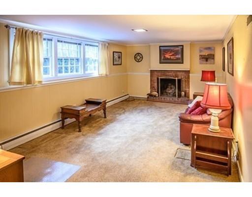 250 Edgewater Drive Needham, MA 02492 - Photo 16 of 27 a living room with furniture a window and a fireplace