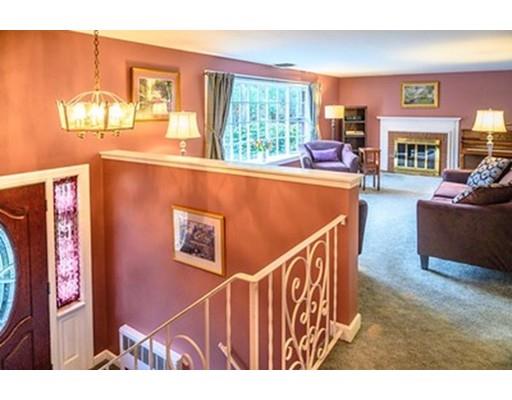 250 Edgewater Drive Needham, MA 02492 - Photo 2 of 27 a view of living room kitchen with furniture and a fireplace