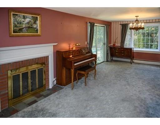 250 Edgewater Drive Needham, MA 02492 - Photo 8 of 27 a living room with furniture and a fireplace