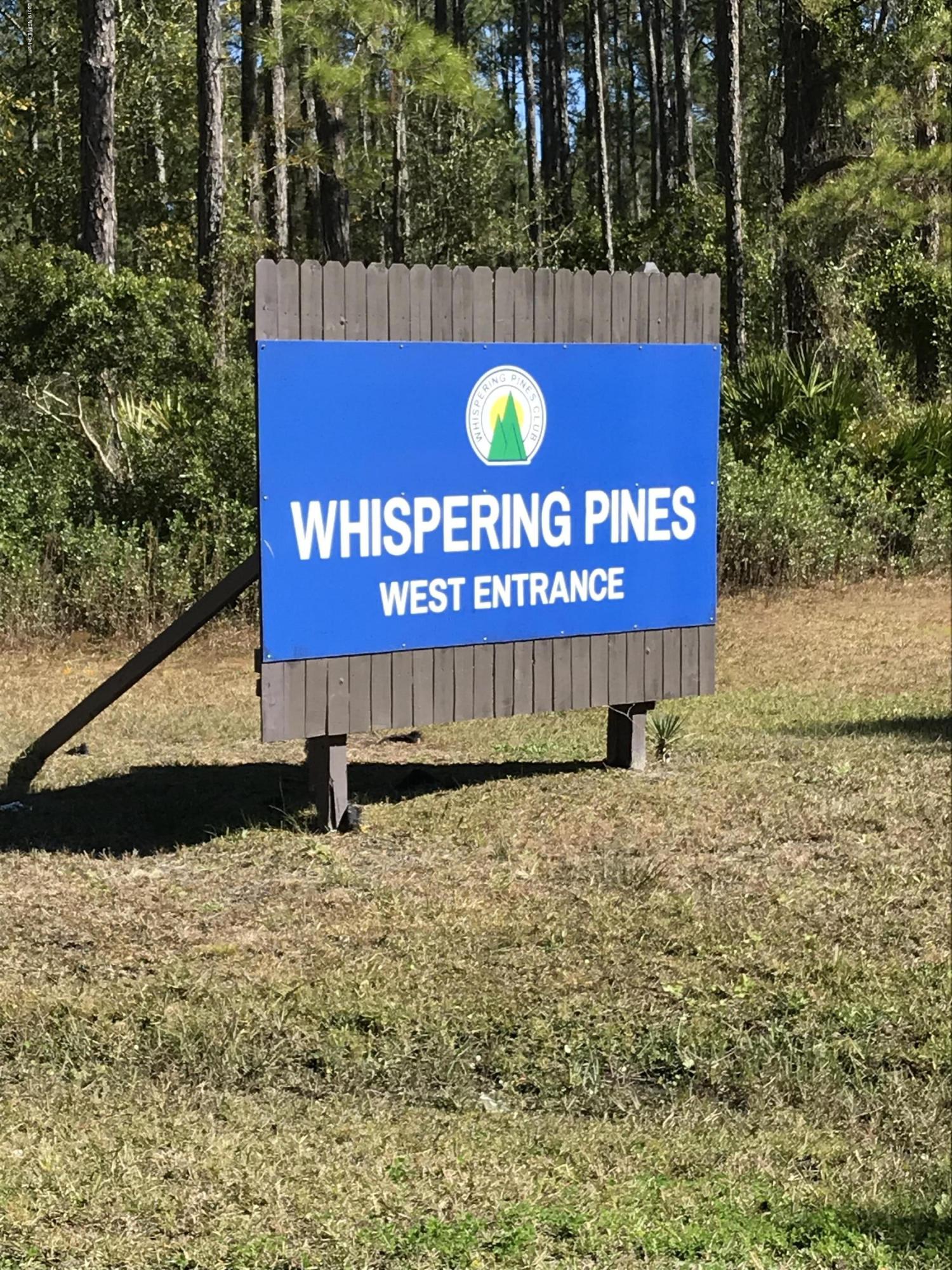 202 Whispering Pines Road Georgetown, FL 32139 - Photo 1 of 7 a sign that is sitting on a brick wall